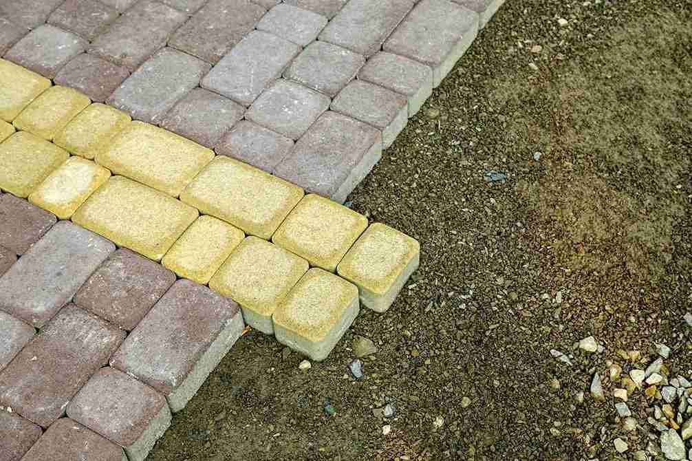installation-of-stone-paving-slabs-in-a-yard-2026-01-06-10-09-52-utc_11zon